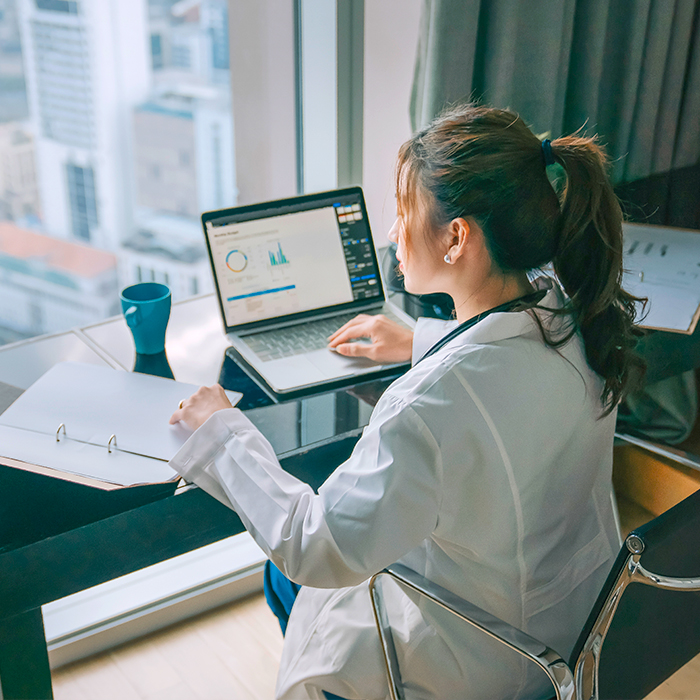 woman looking at a computer screen